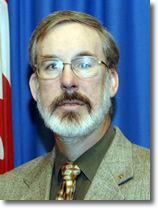 Dr Alan Okros